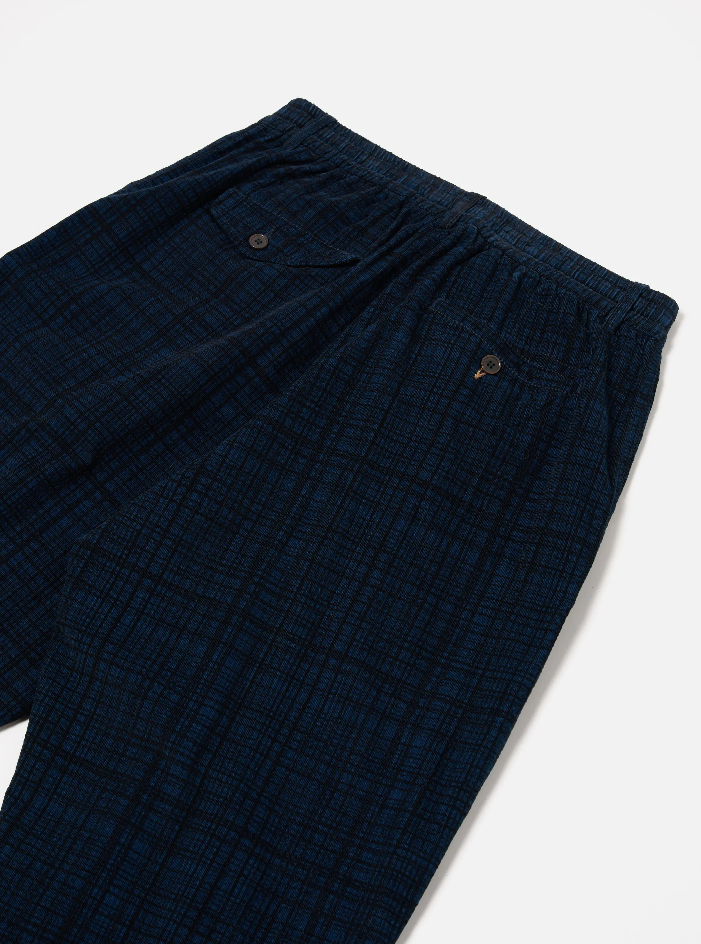 Universal Works Pleated Track Pant in Navy Check Cord Seersucker